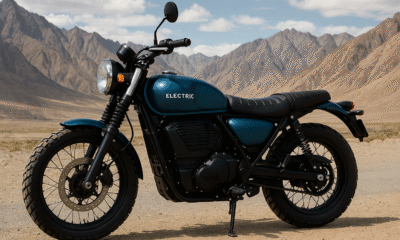 Electric scrambler motorcycle parked in the Ladakh mountains under a clear sky.