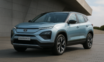 Tata Harrier EV parked outdoors showing front-side view with blue body and bold design.